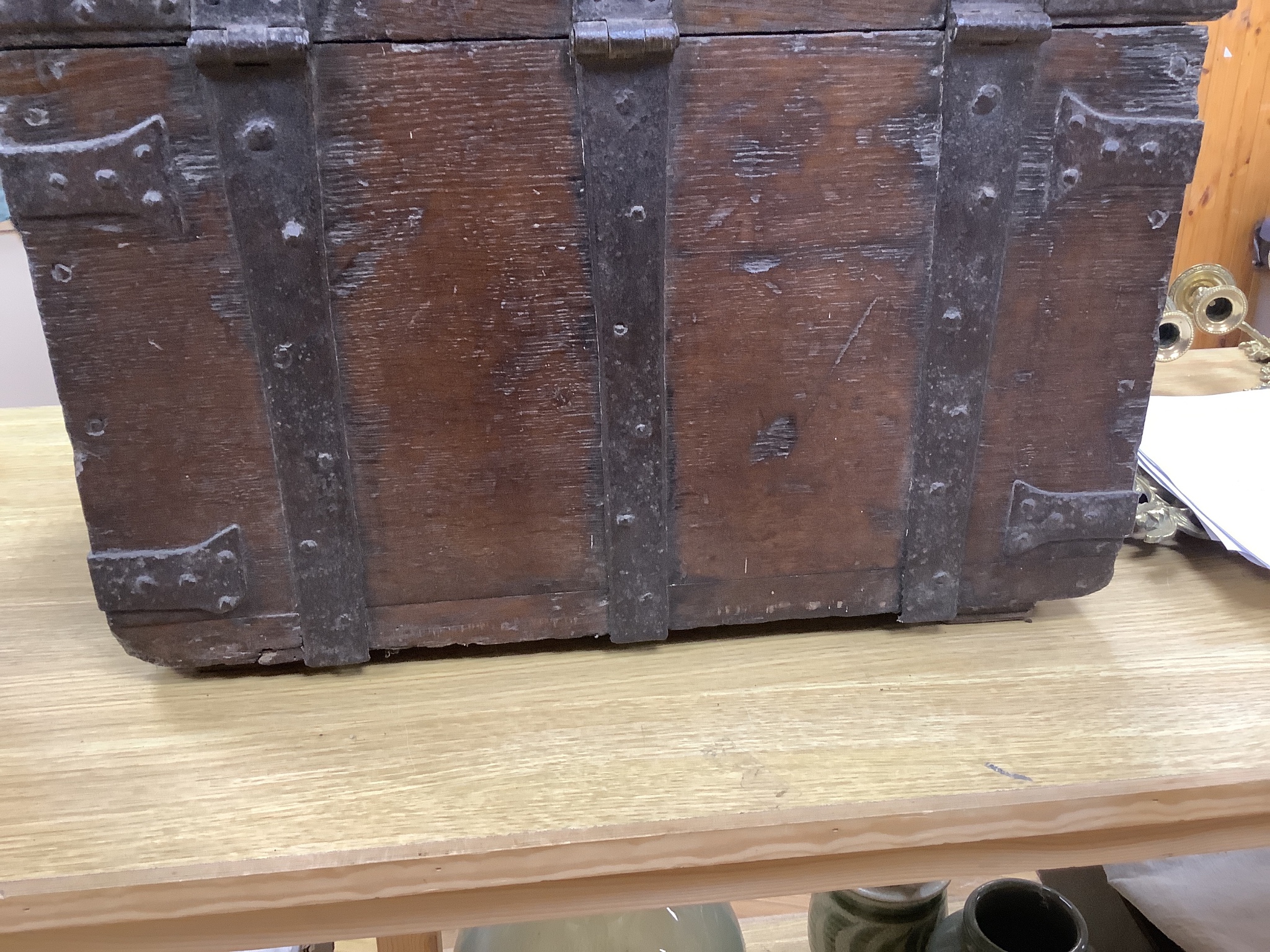 A 17th/18th century iron bound oak strong box, 60cm wide, 36cm deep, 35.5cm high